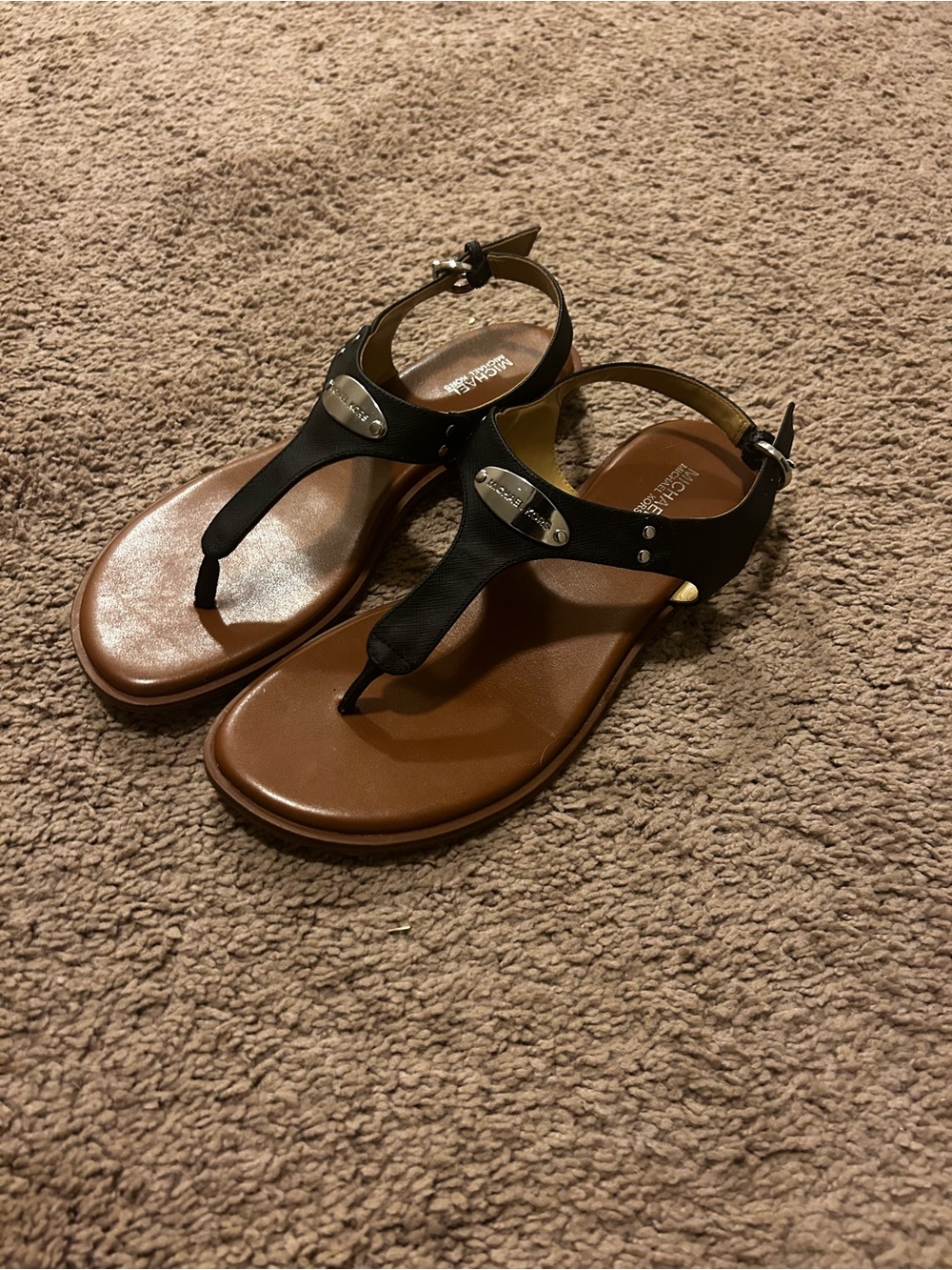 Michael Kors Women’s Black T-StrapFlat Sandals Silver Logo Buckle (Size 9)